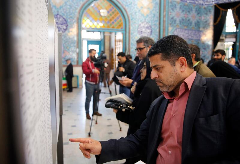Iranians fill in their ballot papers at a polling station during the parliamentary elections in Tehran, Iran. Iranians head to polls amid a worsening economic crisis and escalating tensions with the United States.  EPA