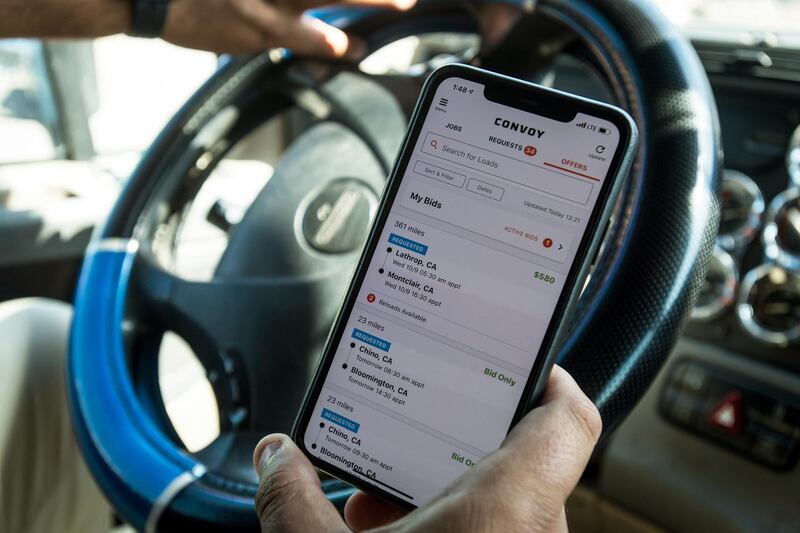 The Convoy Inc. application is displayed on a smartphone in an arranged photograph taken in Patterson, California, U.S., on Monday, Oct. 7, 2019. Convoy hooked truck drivers with an app to easily find jobs and get paid quickly. Now it needs to address concerns about low prices and figure out how to turn a profit. Photographer: David Paul Morris/Bloomberg