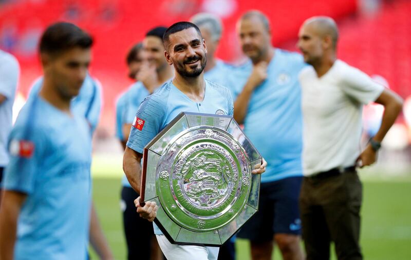 Soccer Football - FA Community Shield - Manchester City v Chelsea - Wembley Stadium, London, Britain - August 5, 2018  Manchester CityÕs Ilkay Gundogan celebrates winning the community shield with the trophy  REUTERS/Phil Noble