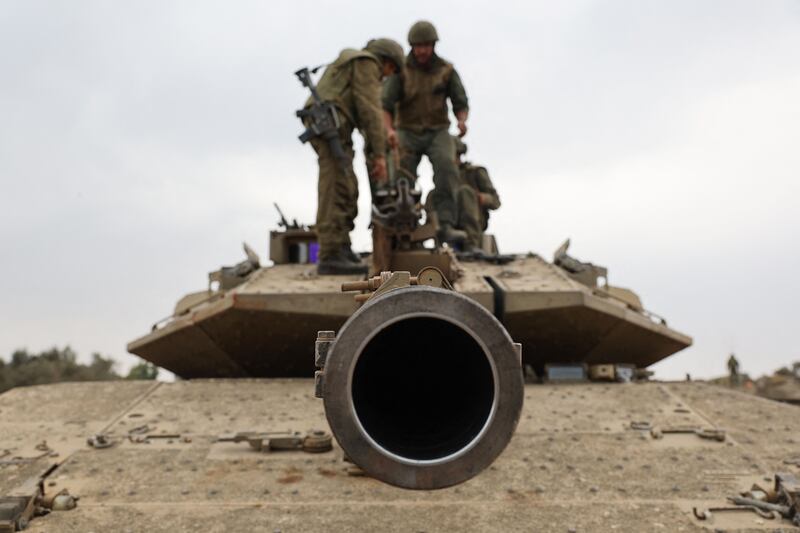 Israeli troops in Merkava tanks take position near the border with the Gaza Strip in southern Israel. AFP