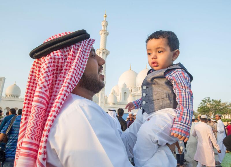 Abu Dhabi, UNITED ARAB EMIRATES - Father and son Mohammed and Zayed at the Sheikh Zayed Grand Mosque.  Leslie Pableo for The National