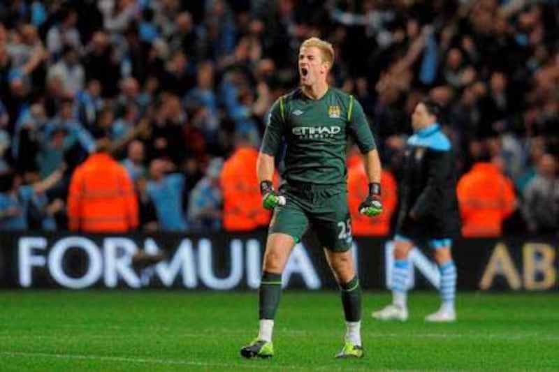 Manchester City's English goalkeeper Joe Hart celebrates after beating Manchester United during their English Premier League football match at The Etihad stadium in Manchester, north-west England on April 30, 2012. AFP PHOTO/ANDREW YATES



RESTRICTED TO EDITORIAL USE. No use with unauthorized audio, video, data, fixture lists, club/league logos or ÒliveÓ services. Online in-match use limited to 45 images, no video emulation. No use in betting, games or single club/league/player publications.

