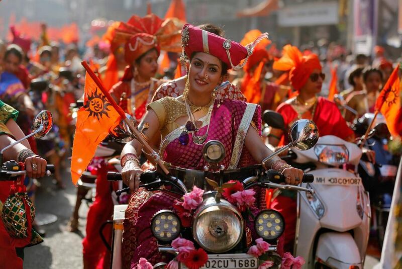 Women dressed in traditional outfits ride motorbikes to celebrate Gudi Padwa. Reuters 