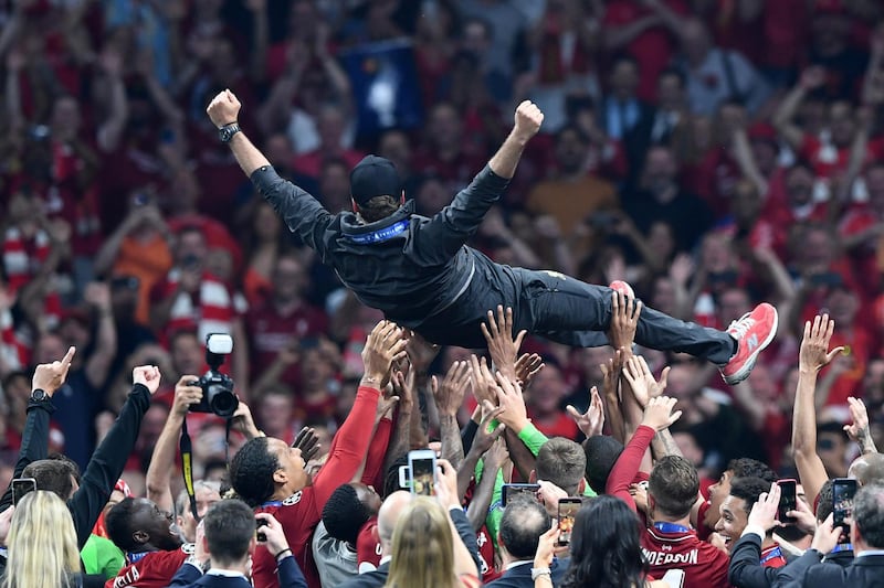 MADRID, SPAIN - JUNE 01: Jurgen Klopp, Manager of Liverpool is thrown in the air as he celebrates with his players and staff after winning the UEFA Champions League Final between Tottenham Hotspur and Liverpool at Estadio Wanda Metropolitano on June 01, 2019 in Madrid, Spain. (Photo by Michael Regan/Getty Images)