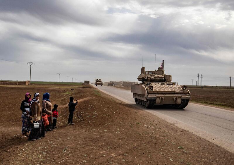 US armour patrols the countryside of the Kurdish-majority city of Qamishli in Syria's northeastern Hasakeh province. Washington says any new offensive in northern Syria could undermine regional stability and put US troops at risk.  AFP