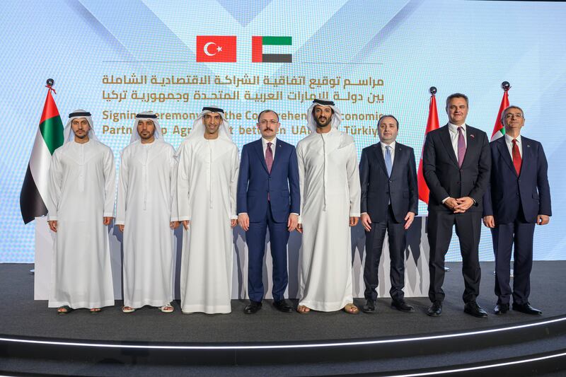 Mr Bin Touq, Mr Mus and Dr Al Zeyoudi, Saeed Thani Hareb Al Dhaheri, the UAE's ambassador to Turkey, and other dignitaries during the signing ceremony. Photo: Hamad Al Kaabi / UAE Presidential Court 
