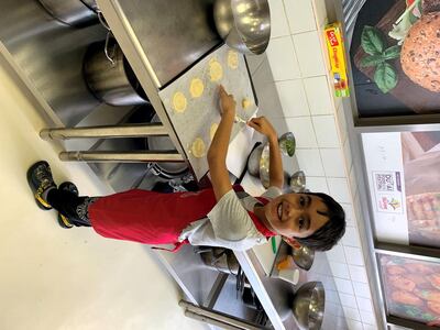 Eight-year-old Daksh Mishra in the kitchen