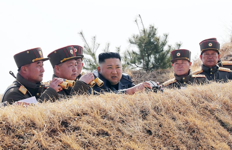 This picture taken on March 20, 2020 and released from North Korea's official Korean Central News Agency (KCNA) on March 21 shows North Korean leader Kim Jong Un (C) inspecting an artillery fire competition between large combined units of the Korean People's Army (KPA) on the western front.  - South Korea OUT / ---EDITORS NOTE--- RESTRICTED TO EDITORIAL USE - MANDATORY CREDIT "AFP PHOTO/KCNA VIA KNS" - NO MARKETING NO ADVERTISING CAMPAIGNS - DISTRIBUTED AS A SERVICE TO CLIENTS / THIS PICTURE WAS MADE AVAILABLE BY A THIRD PARTY. AFP CAN NOT INDEPENDENTLY VERIFY THE AUTHENTICITY, LOCATION, DATE AND CONTENT OF THIS IMAGE ---
 / AFP / KCNA VIA KNS / STR / ---EDITORS NOTE--- RESTRICTED TO EDITORIAL USE - MANDATORY CREDIT "AFP PHOTO/KCNA VIA KNS" - NO MARKETING NO ADVERTISING CAMPAIGNS - DISTRIBUTED AS A SERVICE TO CLIENTS / THIS PICTURE WAS MADE AVAILABLE BY A THIRD PARTY. AFP CAN NOT INDEPENDENTLY VERIFY THE AUTHENTICITY, LOCATION, DATE AND CONTENT OF THIS IMAGE ---
