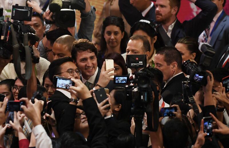 Canada's prime minister Justin Trudeau has a selfie taken with a member of the press during the Association of South East Asian Nations  Summit in Manila. Laurent Fievet / AFP Photo