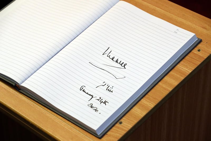 A view of Prince Charles' signature on a book as visits the Mosque of Omar. Getty Images