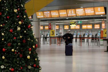 A passenger stands in an almost empty check-in area at Gatwick Airport. The decline in global services trade has been attributed by Unctad to the fall in global travel, transport and tourism activity. Reuters