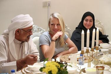 Jana Vintrova chats with Dr Khaled Al Mansoori during an iftar held in Ras Al Khaimh which served up plenty of food and friendship. Chris Whiteoak / The National