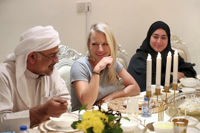 Ras al Khaimah, United Arab Emirates - May 26, 2019: Jana Vintrova 35 from the Czech Republic with Dr Khaled Al Mansoori. Emirati Iftar at Hajar Al Mansouri house as part of the Emirati values iftar project led by the Federal Youth Foundation aims to educate people on traditional UAE values. the project will see Emiratis urged to host expatriates for iftar during Ramadan. Sunday the 26th of May 2019. Ras al Khaimah. Chris Whiteoak / The National