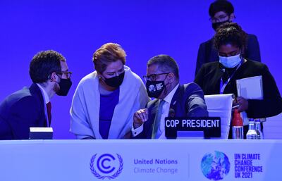 Cop26 president Alok Sharma, centre, was pushing for a deal in Glasgow late on Friday. AFP 