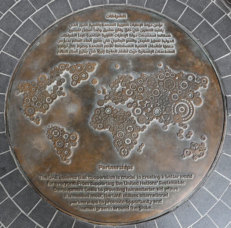 A map made of cogs, showing how we all work together to make the world go round. 'The UAE believes that co-operation is crucial to creating a better world for everyone. From supporting the United Nations’ Sustainable Development Goals to providing humanitarian aid where it is needed most, the UAE utilises international partnerships to promote opportunity and human growth around the globe.'
