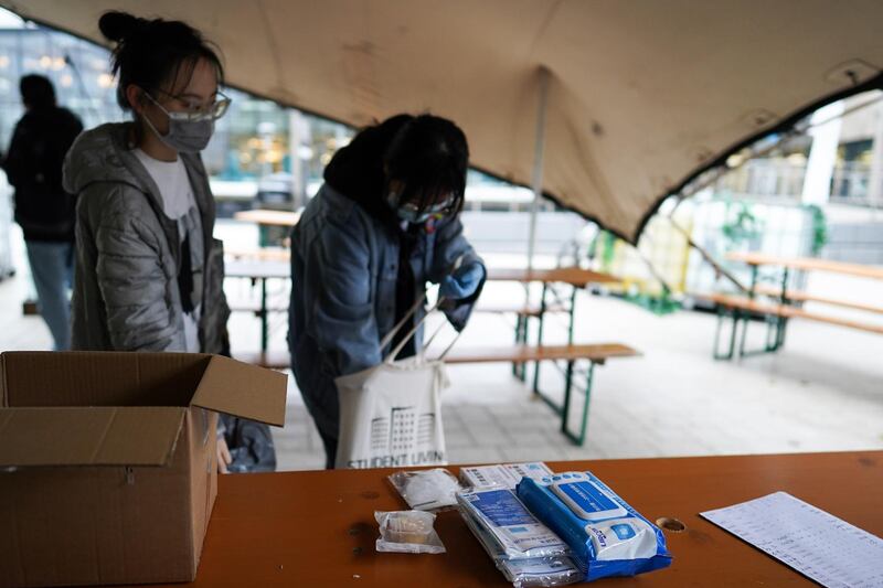 Chinese students at Northumbria University sort out care packages for other Chinese students attending the university. Getty Images