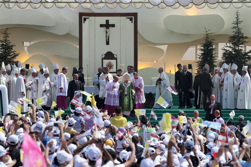 Pope Benedict XVI (C) attends an open-air mass in Beirut's waterfront on September 16, 2012, on the final day of his visit to Lebanon. Pope prayed that leaders in the Middle East work toward peace and reconciliation, in his homily at an open-air mass where an estimated 350,000 people attend. AFP PHOTO/JOSEPH EID (Photo by JOSEPH EID / AFP)