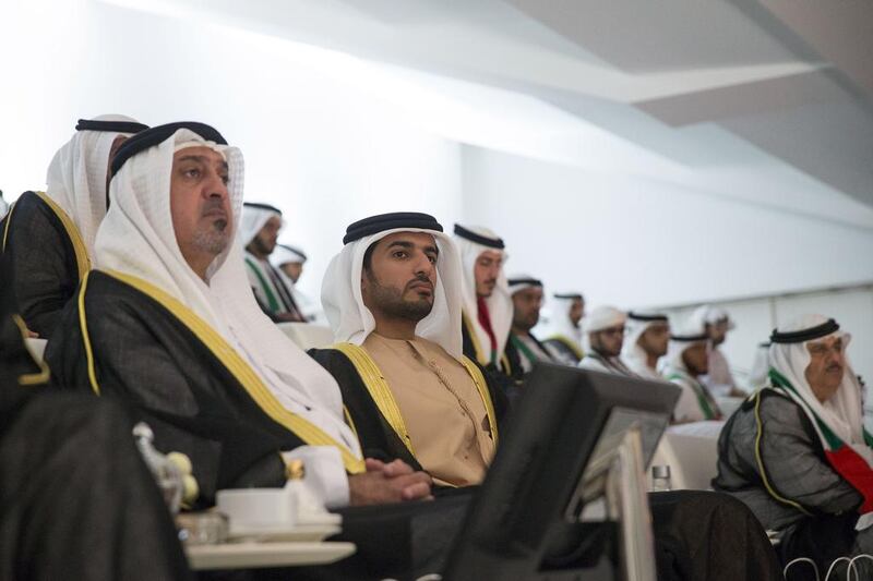 Dr Sheikh Sultan bin Khalifa, Advisor to the President (L) and Sheikh Rashid bin Humaid (C) attend the 44th UAE National Day celebrations at Zayed Sports City. Mohamed Al Hammadi / Crown Prince Court - Abu Dhabi