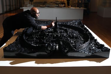 Ghanaian-Canadian artist Ekow Nimako creates a Lego sculpture at the Aga Khan Museum. Using over 100,000 Lego pieces, 'Kumbi Saleh 3020CE' imagines a Ghanaian metropolis 1,000 years in the future. Getty Images 