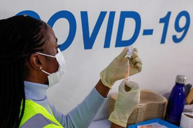 FILE PHOTO: A dose of AstraZeneca vaccine is prepared at COVID-19 vaccination centre in the Odeon Luxe Cinema in Maidstone, Britain February 10, 2021. REUTERS/Andrew Couldridge/File Photo