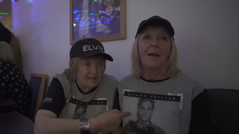 Sisters Christine and Jean, in matching T-shirts and caps, have been attending the Porthcawl Elvis Festival since it began in 2004.