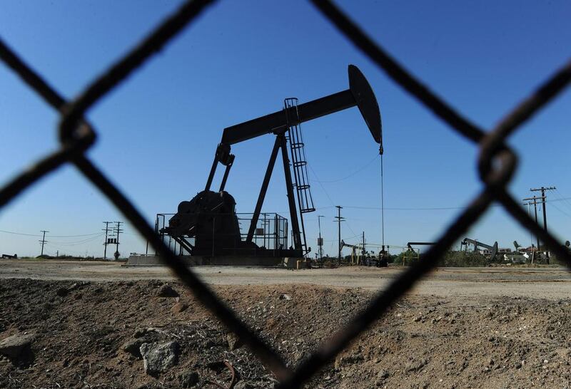 Oil pumps in operation at an oilfield near central Los Angeles. The fall in the price of oil is hitting employment levels in the sector in the US. Mark Ralston / AFP