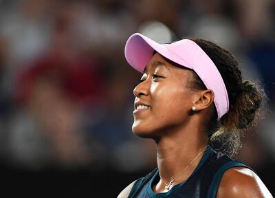 epa07286205 Naomi Osaka of Japan reacts during her women's first round match against Magda Linette of Poland at the Australian Open tennis tournament in Melbourne, Australia, 15 January 2019.  EPA/LUKAS COCH AUSTRALIA AND NEW ZEALAND OUT