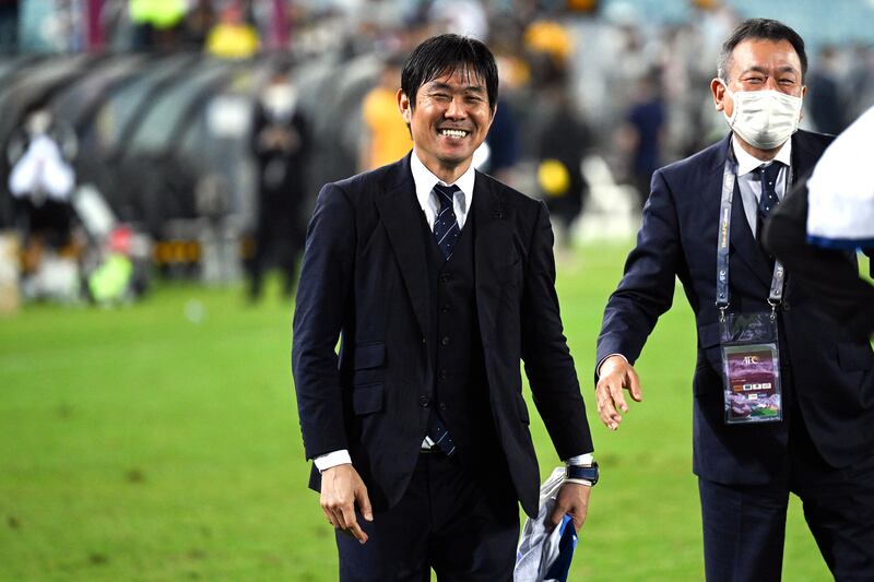 Japan manager Hajime Moriyasu celebrates after beating Australia. EPA