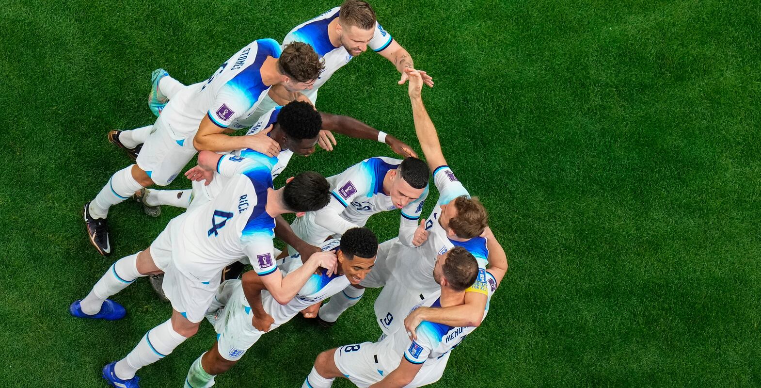 England's players celebrate after scoring the opening goal of their team against Senegal during the World Cup round of 16 soccer match between England and Senegal, at the Al Bayt Stadium in Al Khor, Qatar, on Sunday, Dec.  4, 2022.  (AP Photo / Petr David Josek)