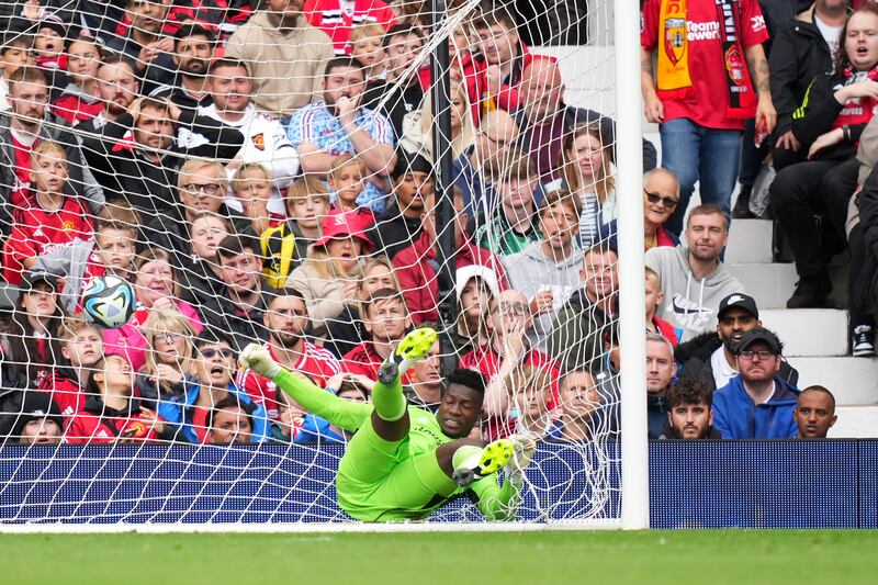 Manchester United keeper Andre Onana fails to save a shot from Florian Sotoca of Lens. Getty 