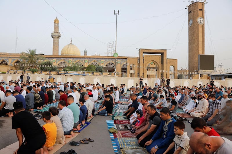 Worshippers offer Eid Al Fitr prayers outside Abu Hanifa mosque in Baghdad, Iraq. Reuters