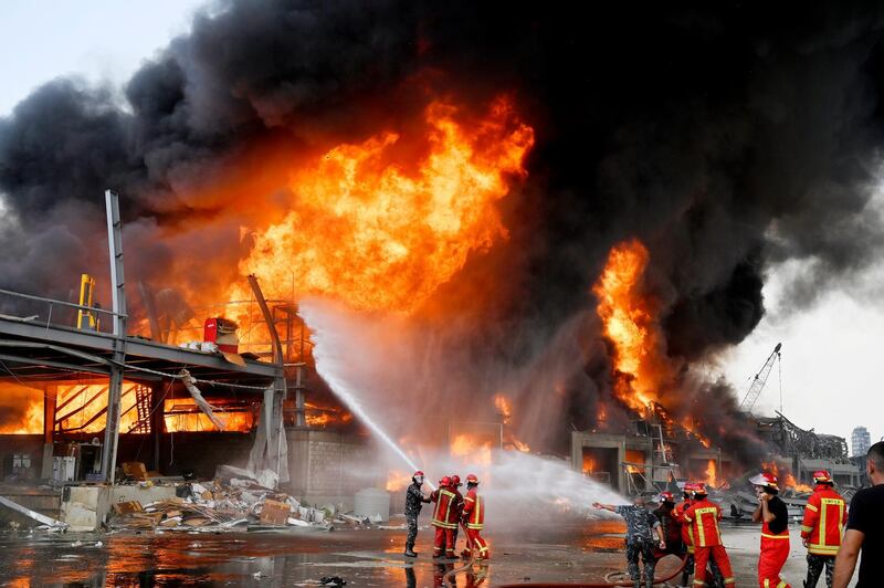 Lebanese firefighters try to extinguish a fire at the Beirut port. EPA