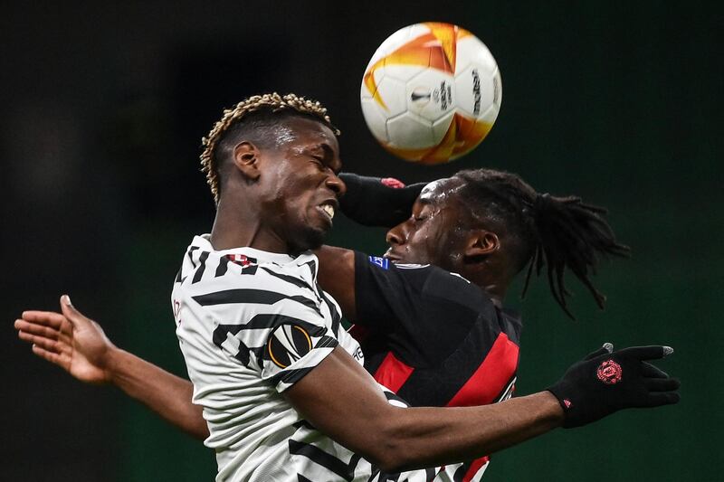 Manchester United's French midfielder Paul Pogba, left, and AC Milan's French midfielder Souhaliho Meite go for a header during the Uefa Europa League round of 16 second leg football game at the San Siro stadium in Milan, Italy. Pogba scored the only goal of the game, to take United into the competition's quarter finals. AFP
