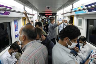 Iranians wear face masks while riding the metro in Tehran, Iran. Reuters