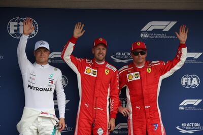 HOCKENHEIM, GERMANY - JULY 21:  Top three qualifiers Sebastian Vettel of Germany and Ferrari, Kimi Raikkonen of Finland and Ferrari and Valtteri Bottas of Finland and Mercedes GP celebrate in parc ferme during qualifying for the Formula One Grand Prix of Germany at Hockenheimring on July 21, 2018 in Hockenheim, Germany.  (Photo by Charles Coates/Getty Images)