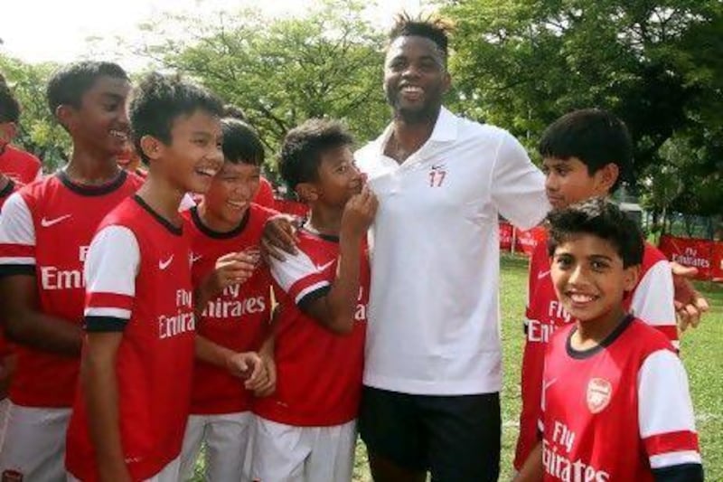 Alex Song, third right, at an Arsenal skills clinic for young footballers at a hotel in Selangor, outside Kuala Lumpur.