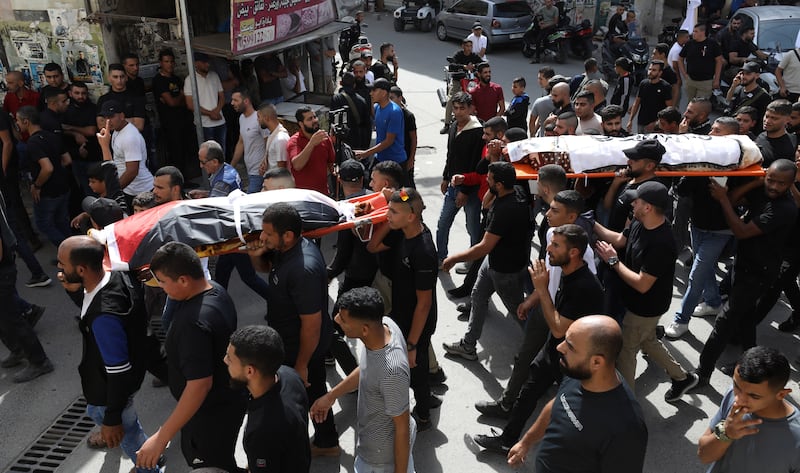 Relatives and friends of Palestinians Mohhamed Abed and Mohhamed Abdallah, two men killed in an Israeli air strike at Al-Ansar Mosque in Jenin, attend their funeral in the west bank city of Jenin. EPA