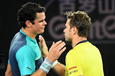 MELBOURNE, AUSTRALIA - JANUARY 17:  Milos Raonic of Canada and Stan Wawrinka of Switzerland embrace at the net after their second round match during day four of the 2019 Australian Open at Melbourne Park on January 17, 2019 in Melbourne, Australia.  (Photo by Quinn Rooney/Getty Images)