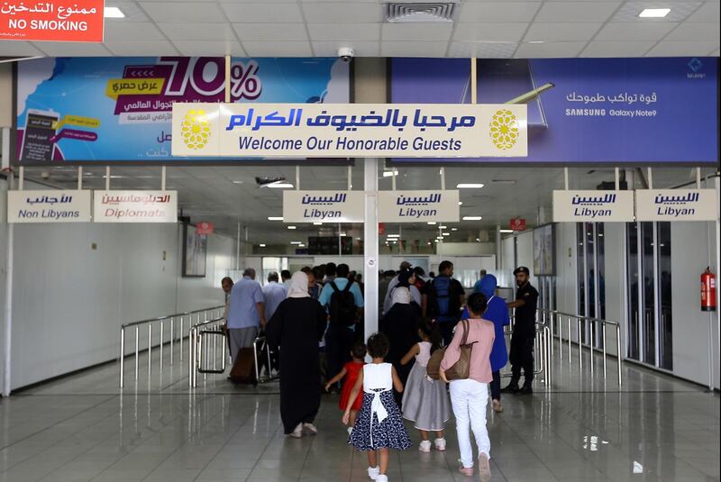 Travellers arrive at the Mitiga International Airport after its reopening, in the Libyan capital of Tripoli.  AFP