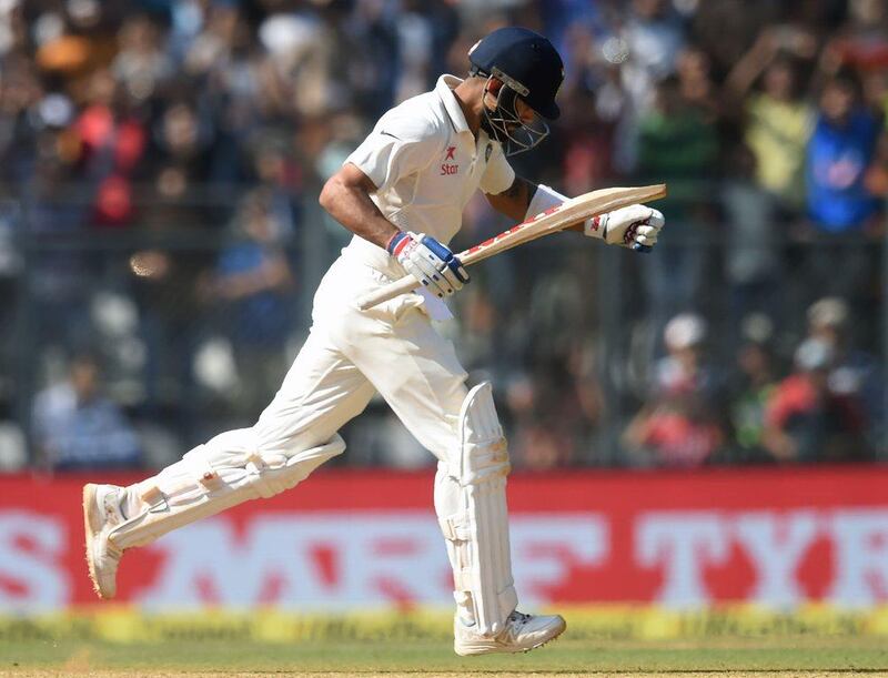 India cricketer Virat Kohli celebrates after scoring a double century (200 runs) on Sunday. Punit Paranjpe / AFP