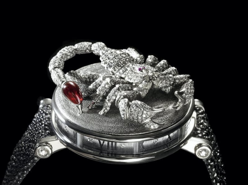 The Scorpion watch for Michael Jackson is executed in patinated 18K white gold and set with micro pavé grey and white diamonds. With ruby eyes and a rubellite stinger, the scorpion crouches on a guilloche top 