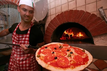 Chef Alessandro D'ubaldo cooking one of his special pizzas at 800Pizza. 