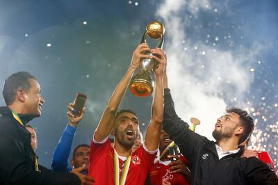 Soccer Football - African Champions League Final - Zamalek v Al Ahly - Cairo International Stadium, Cairo, Egypt - November 27, 2020  Al Ahly's Hussein El Shahat celebrates with the trophy and teammates after winning the final REUTERS/Amr Abdallah Dalsh