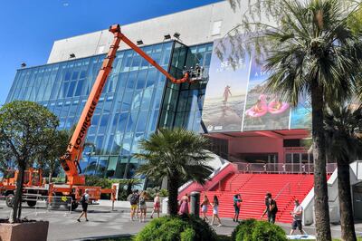 Workers wash the windows during the preparations for the Cannes festival at the Palais des Festivals in Cannes, France, on June 25, 2021. Photo by Lionel Urman/ABACAPRESS.COM
