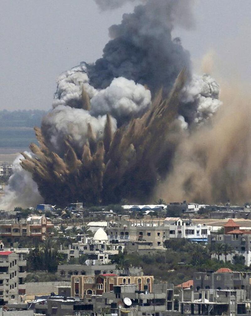 Smoke is seen following what police said was an Israeli air strike in Rafah in the southern Gaza Strip on July 8, 2014. Reuters