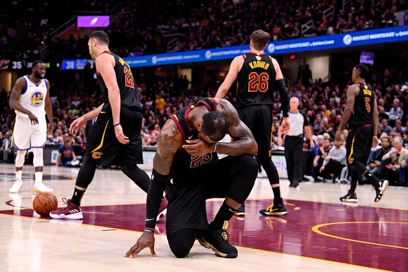Cleveland Cavaliers forward LeBron James reacts after an injury during the second quarter against the Golden State Warriors. Kyle Terada / Reuters
