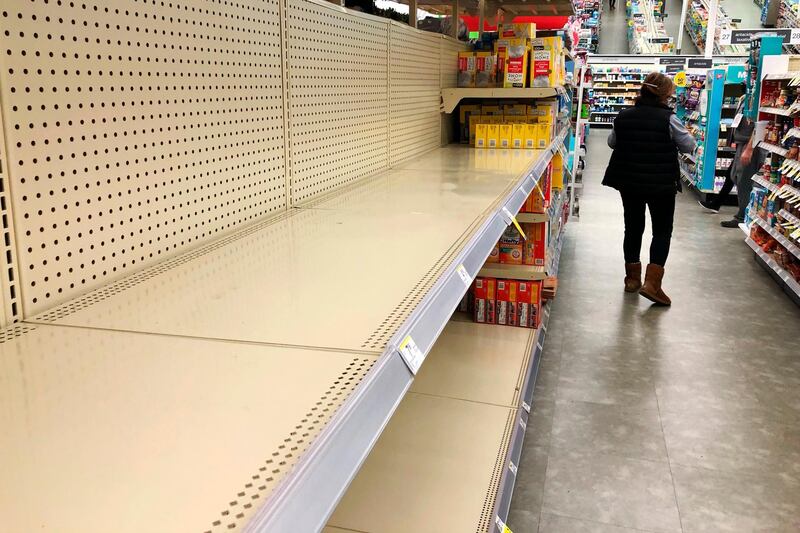 Shelves in the toilet paper aisle at a Walgreens store sit empty in Buffalo Grove, Illinois. AP Photo