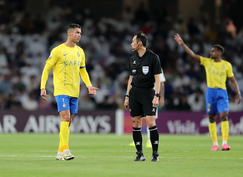 Al Nassr's Cristiano Ronaldo speaks with the referee. 