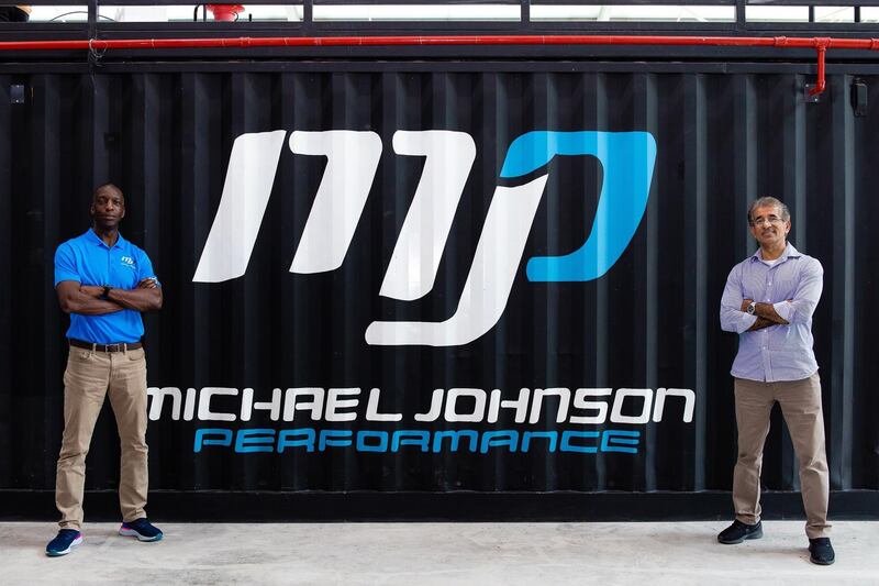 Former Olympic champion Michael Johnson, left, is to open an elite fitness centre in Dubai, with Adnan Al Abbar, DP World Group planning and project management Senior Vice President. Courtesy DP World