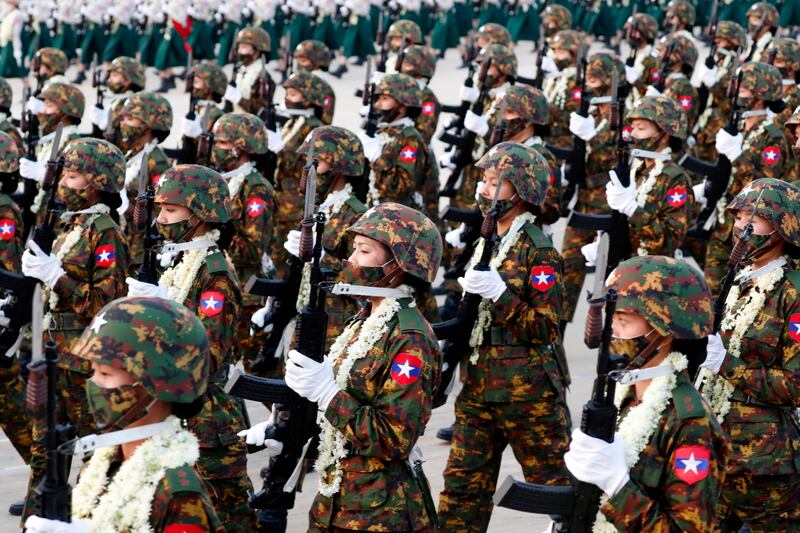 Myanmar female soldiers march at the parade. EPA